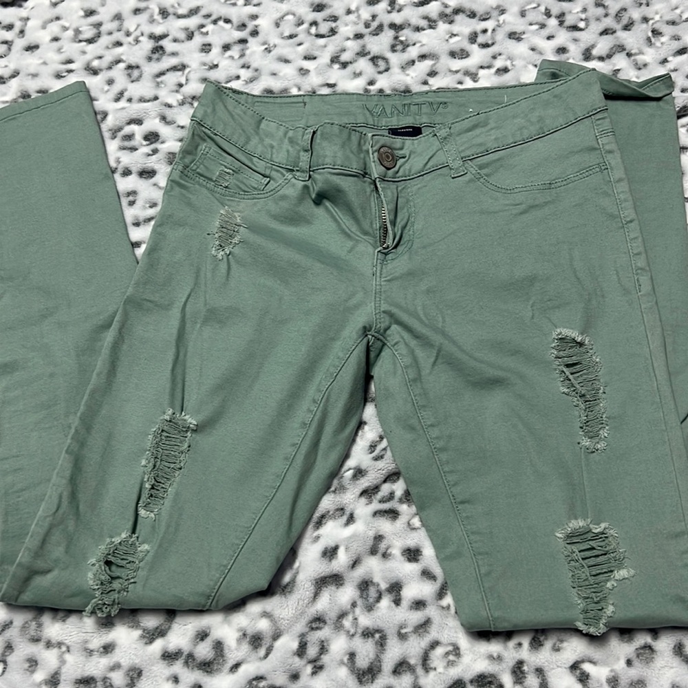 Green distressed skinny jeans